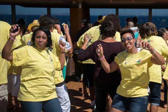 Soul Train Cruise 2014: Two female passengers on deck dancing at the T-Shirt Pool Party.