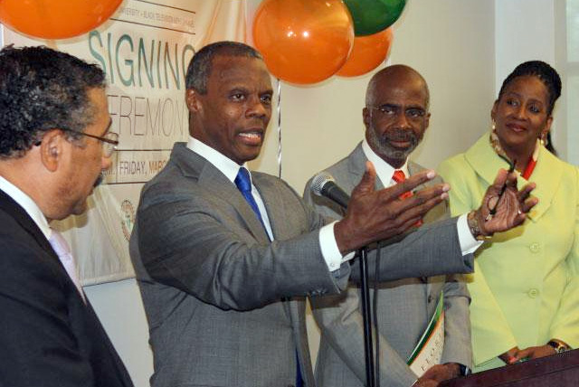 Tallahassee Mayor John Marks (left) looks on with Interim President Larry Robinson and Dean Ann Kimbrough as Black Television News Channel founder J.C. Watts talks about how monumental this partnership is.