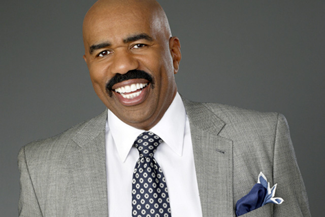 American actor, comedian, entertainer, television/radio personality and author Steve Harvey smiles for photo shoot.