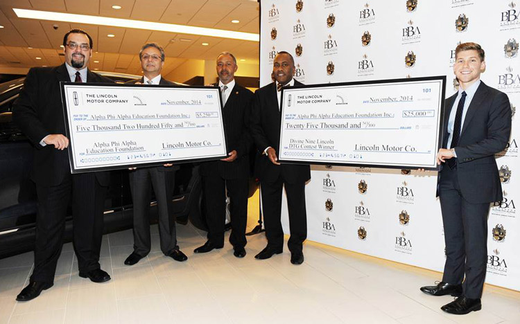Alpha Phi Alpha Fraternity, Inc. receiving checks from Lincoln Motor Company as winner of the Divine Nine Driven to Give Program.