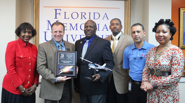 Cessna Pilot Center presents Florida Memorial University with official plaque.