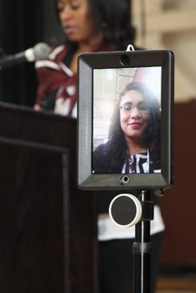 AAMU faculty member Stacy Carter conducts a history class on the Huntsville campus from his suburban Birmingham home in Hoover using telepresence robot.