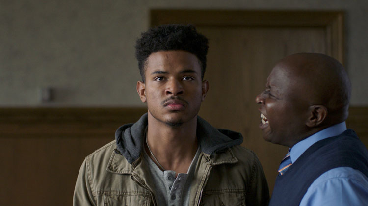 A scene from the film ‘Burning Sands,’ featuring actors Trevor Jackson and Steve Harris.