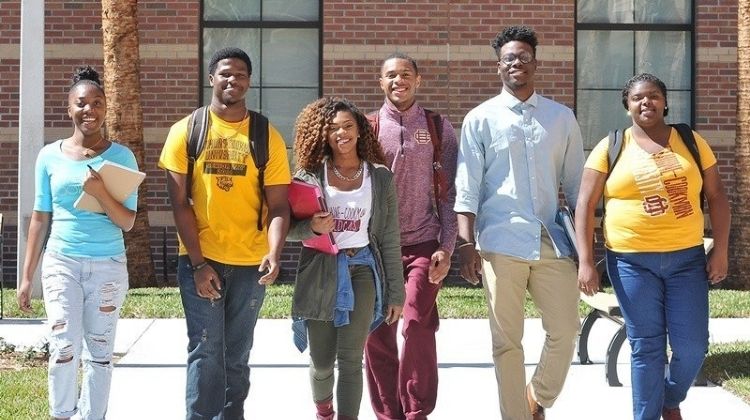 A group of Bethune Cookman Nontraditional HBCU students walking on Campus.